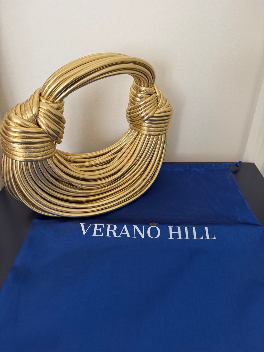 Verano Hill Metallic Gold Knot Wristlet Clutch